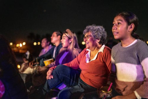 group of people enjoying a movie at the outdoors cinema - concert stock pictures, royalty-free photos & images