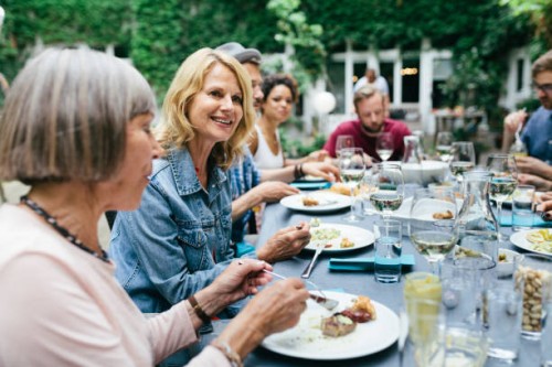 group of people enjoying an outdoor meal together - food stock pictures, royalty-free photos & images