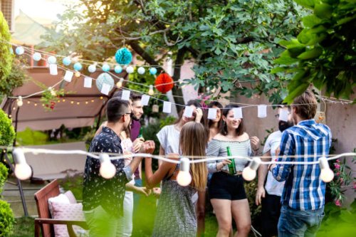 group of pretty young people have a summer party in a backyard - garden decoration stock pictures, royalty-free photos & images