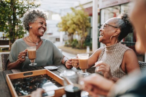 group of senior friends at coffee shop - coffee stock pictures, royalty-free photos & images