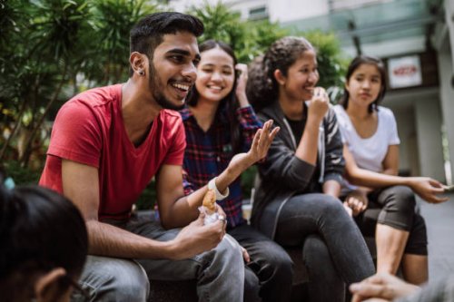 group of students joking and getting to know each other - junk food stock pictures, royalty-free photos & images