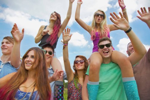 group of teenagers cheering at music festival - concert stock pictures, royalty-free photos & images