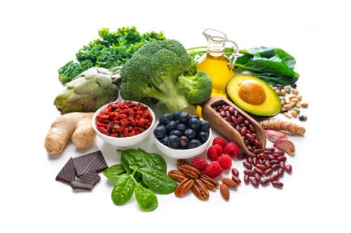 group of vegan food rich in antioxidants on white background - food stock pictures, royalty-free photos & images