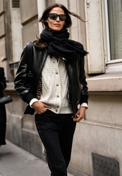 Guest is seen wearing a black leather jacket, white sweater, black pants with black sunglasses outside the Gabriela Hearst show during Womenswear...