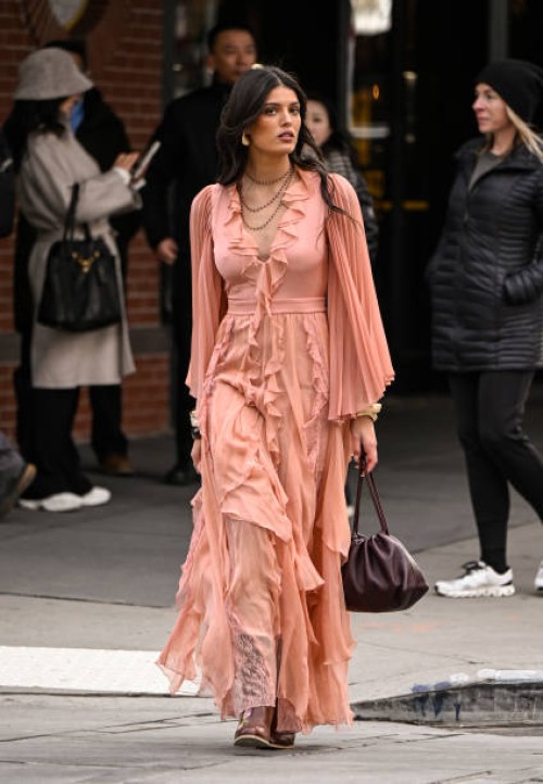 Guest is seen wearing a pink Alice and Olivia dress and brown boots outside the Alice and Olivia presentation during NYFW F/W 2025 on February 08,...