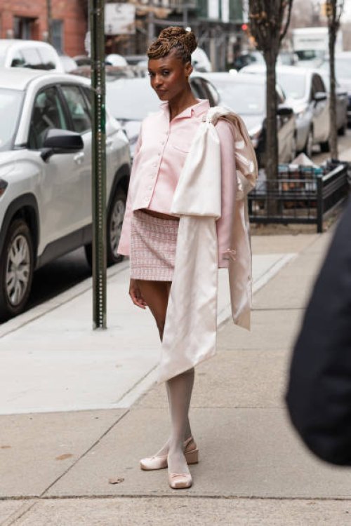 Guest is seen wearing a pink top, pink skirt and pink shoes outside the Sandy Liang show during February 2024 New York Fashion Week on February 11,...