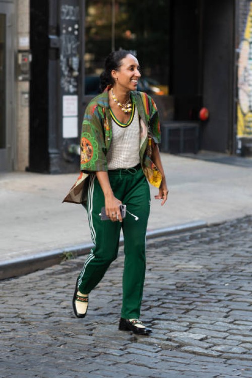 Guest is seen wearing a printed shirt and green pants outside the Head of State show during New York Fashion Week on September 13, 2023 in New York...