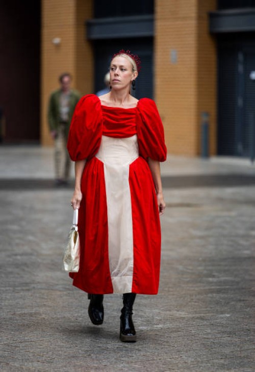 Guest is seen wearing two tone red beige dress outside Simone Rocha during London Fashion Week September 2023 on September 17, 2023 in London,...