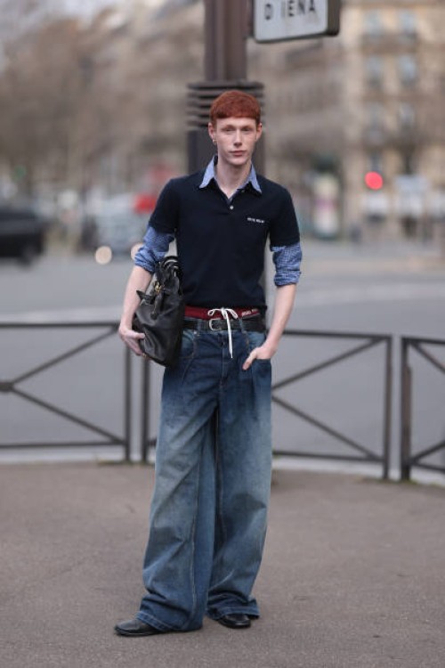 Guest seen wearing a Miu Miu navy blue Poloshirt over a blue shirt, Miu Miu large black leather bag, gold jewellery, Miu Miu red underwear with bow,...