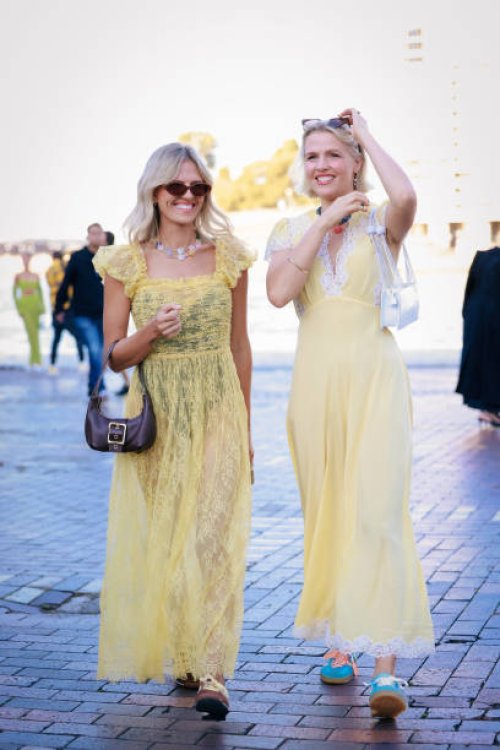 Guest wearing yellow lace dress during Australian Fashion Week Presented By Pandora 2024 at Carriageworks on May 14, 2024 in Sydney, Australia.