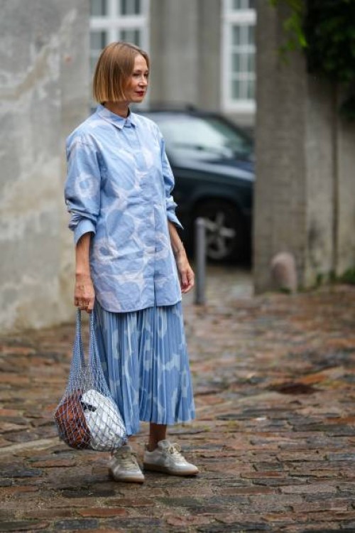Guest wears a blue and pale blue print pattern shirt neck / long sleeves / buttoned shirt, a matching blue and pale blue print pattern pleated /...