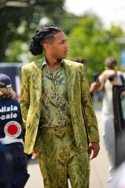 Guest wears a pale green with beige and dark green flower print pattern shirt from Etro, a matching green with brown and beige flower print pattern...