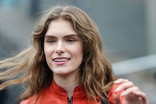 Guest wears a red leather jacket, outside Gucci, during the Milan Fashion Week Womenswear Fall/Winter 2025/2026 on February 25, 2025 in Milan, Italy.