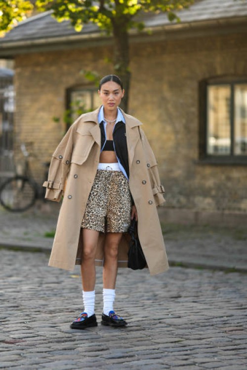 Guest wears a silver rhinestones necklace, a pale blue shirt, a black blazer jacket, a beige long trench coat, white panties, beige and black leopard...
