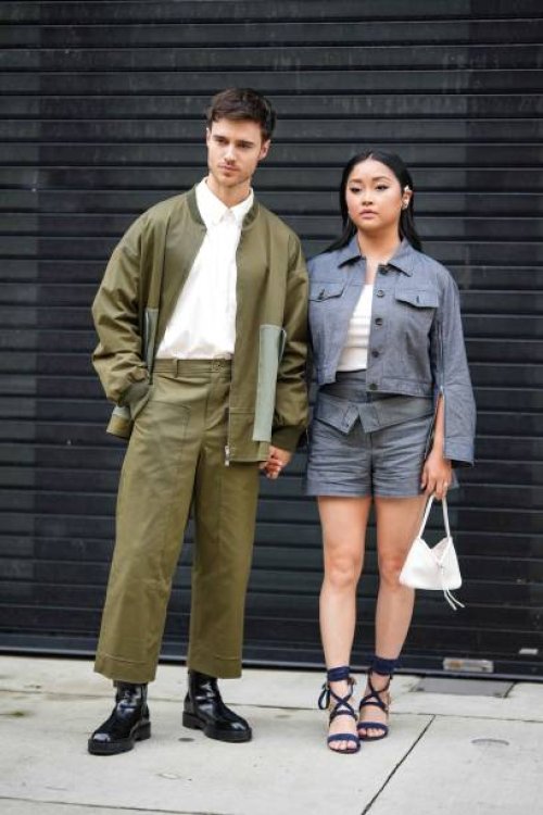 Guest wears a white shirt, a green oversized khaki jacket, matching pants, black leather shoes ; a guest wears a blue denim jacket, a white low-neck...