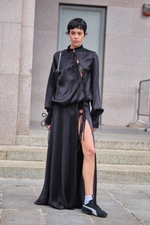 Guest wears Japanesse style Fiorucci dress in black during the Milan Fashion Week Menswear Spring/Summer 2025 on September 17, 2024 in Milan, Italy.