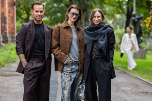 Guest wears suit & Marianne Theodorsen wears brown wild leather jacket, denim jeans with print, blue bag, grey shirt & Tine Andrea wears grey scarf,...