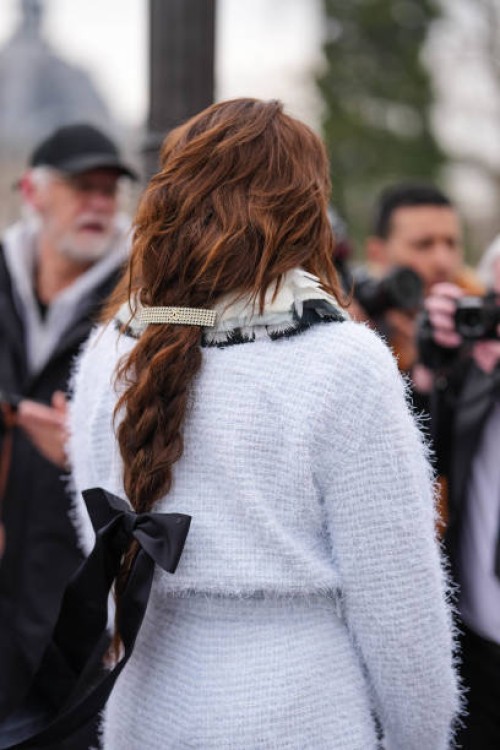Guest wears white light blue layered collar white oversized buttoned fuzzy tweed Chanel blazer jacket, white oversized fuzzy tweed Chanel mini...