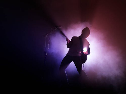 guitarist performing on stage - concert stock pictures, royalty-free photos & images