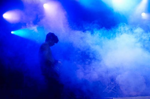 guitarist performing on stage at music concert - concert stock pictures, royalty-free photos & images