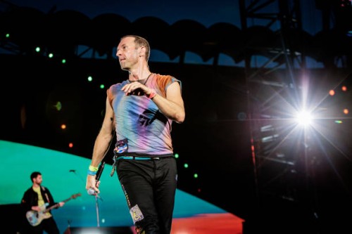 Guy Berryman and Chris Martin of Coldplay perform at Stadio San Siro, on June 25, 2023 in Milan, Italy.