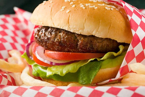 hamburger with lettuce, tomato, red onion and french fries - junk food stock pictures, royalty-free photos & images