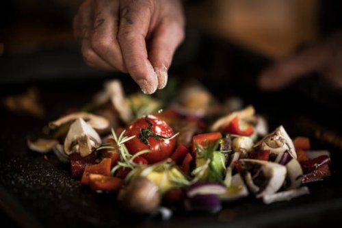 hand seasoning vegetables ona a baking tray - food stock pictures, royalty-free photos & images