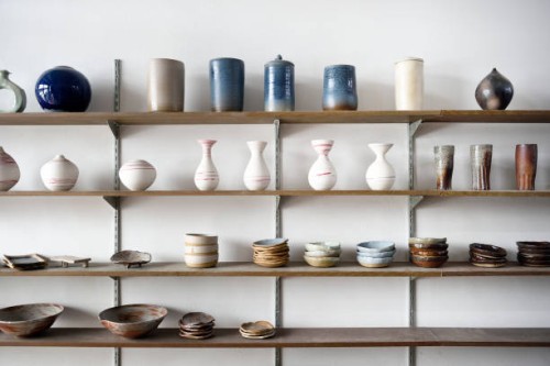handmade ceramic vases and dishes on display in a shop - home decoration stock pictures, royalty-free photos & images