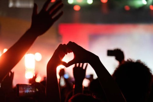 hands making heart shape at music festival - concert stock pictures, royalty-free photos & images