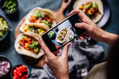 hands of cook photographing mexican tacos - food stock pictures, royalty-free photos & images