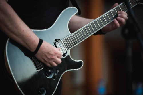 hands playing a chord on an electric guitar - concert stock pictures, royalty-free photos & images