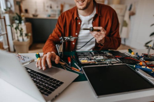 handsome man using laptop on table at home - home decoration stock pictures, royalty-free photos & images