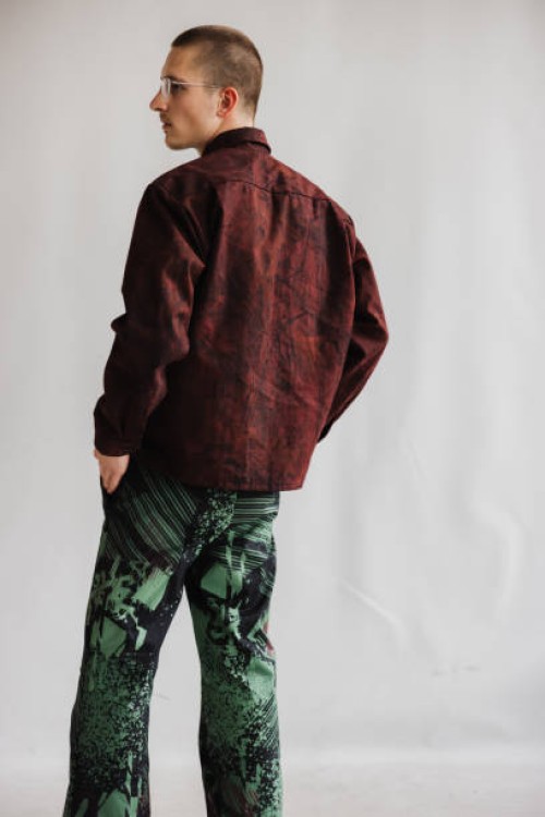 handsome men in side profile stands with his back to the camera posing retro fashion portrait - fashion stock pictures, royalty-free photos & images