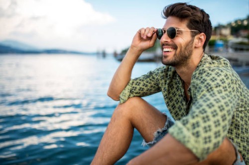 handsome smiling man looking away. - fashion stock pictures, royalty-free photos & images