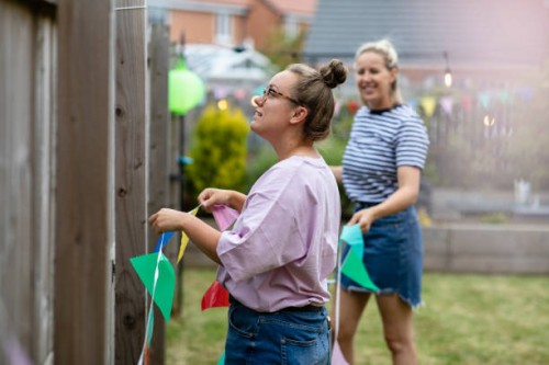 hanging up the bunting - garden decoration stock pictures, royalty-free photos & images