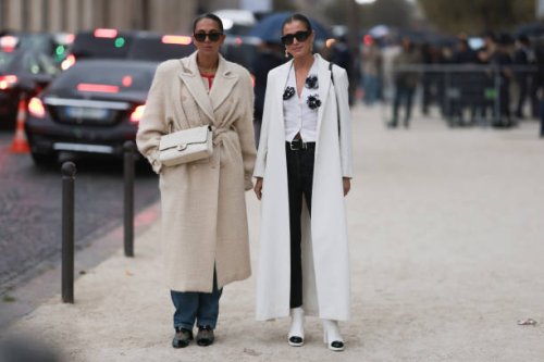 Hanna MW wears black. Sunnies, creme white belted coat, white Chanel Flap Bag Medium size, denim jeans and black and crystal net shoes & Darja...