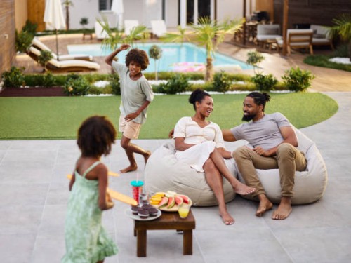 happy black family spending a spring day in the backyard. - garden decoration photos et images de collection