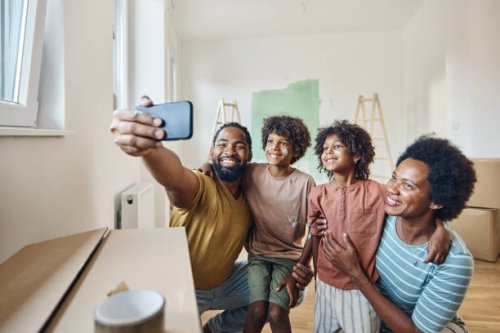 happy black family taking a selfie after moving in into a new apartment. - home decoration stock pictures, royalty-free photos & images