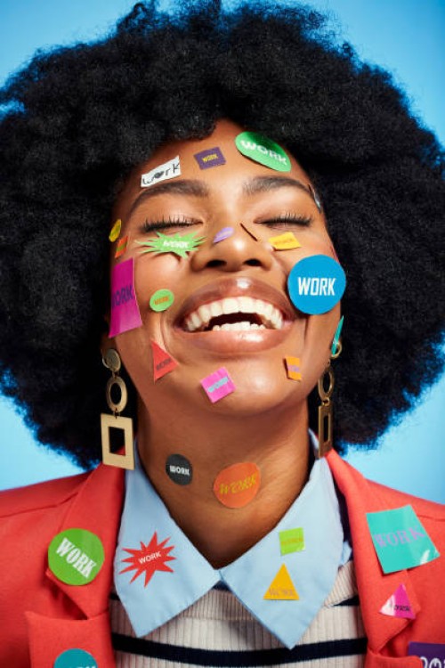 happy black woman with work stickers on face for creative success, entrepreneurship or love her career opportunity or job on blue studio background. smile, creativity and voice of a business manager - fashion stock pictures,