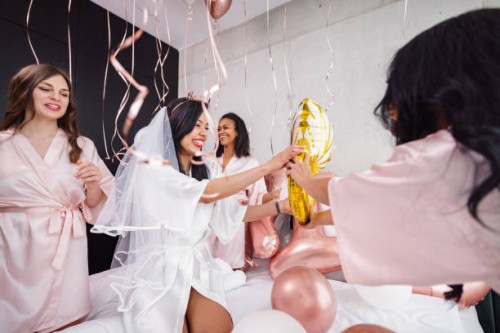 happy bride-to-be and her bridesmaids playing with balloons at a bachelorette party - home decoration stock pictures, royalty-free photos & images