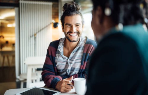 happy businessman having coffee with colleague - coffee stock pictures, royalty-free photos & images