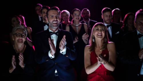 happy couple applauding while watching opera - concert stock pictures, royalty-free photos & images