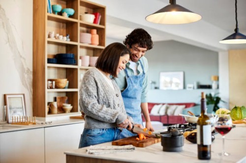 happy couple cooking food together at home - food stock pictures, royalty-free photos & images