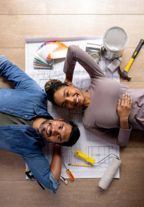 happy couple working on a home improvement project - home decoration stock pictures, royalty-free photos & images