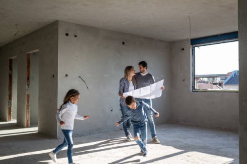 happy family analyzing plans at their new apartment - home decoration stock pictures, royalty-free photos & images
