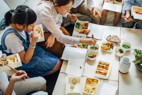 happy family having meal - junk food stock pictures, royalty-free photos & images