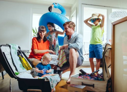 happy family of five packing for holiday trip - travel stock pictures, royalty-free photos & images