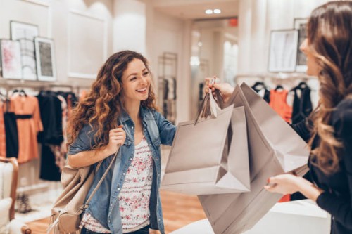 happy girl shopping in the fashion store - fashion stock pictures, royalty-free photos & images