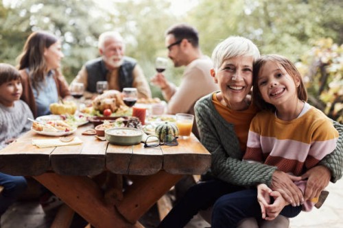 happy grandmother and granddaughter during family's lunch on a terrace. - food stock pictures, royalty-free photos & images