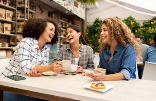 happy group of women having fun talking at a coffee shop - coffee stock pictures, royalty-free photos & images